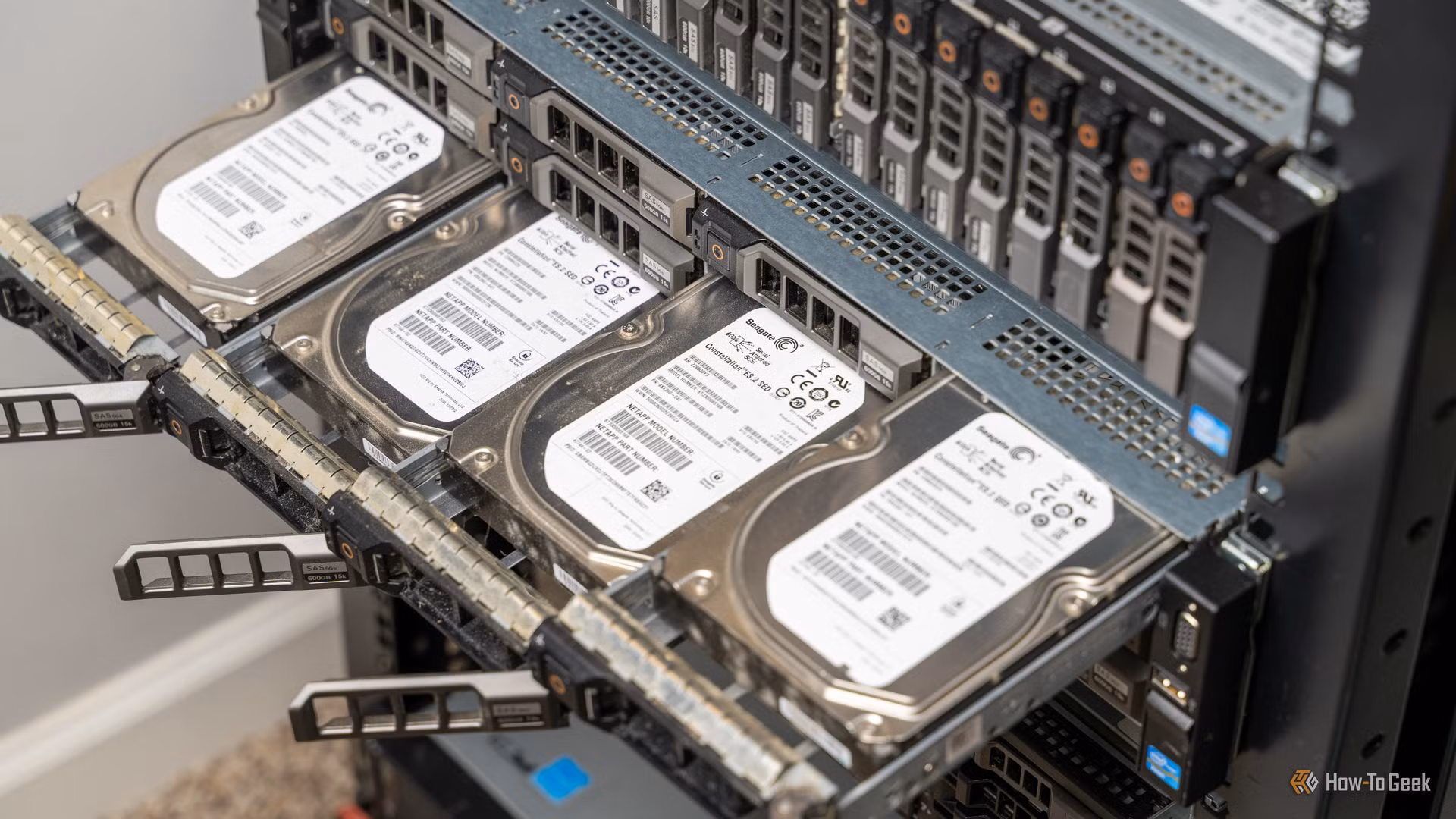 Four hard drivers sticking out of a rack-mount server that
