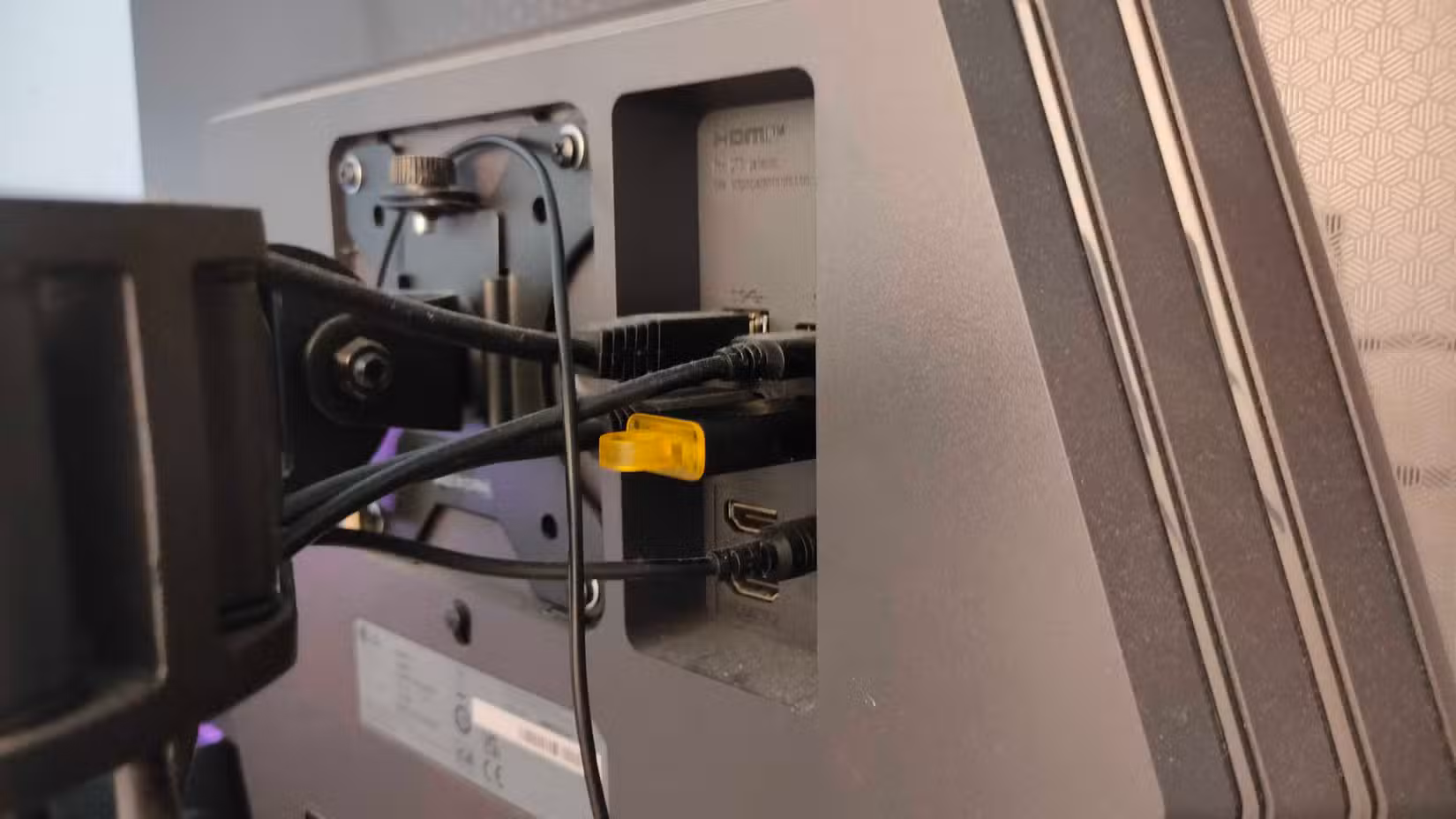 A USB flash drive plugged into a monitor.