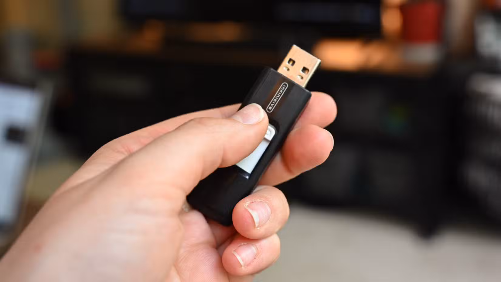 Person holding a thumb drive