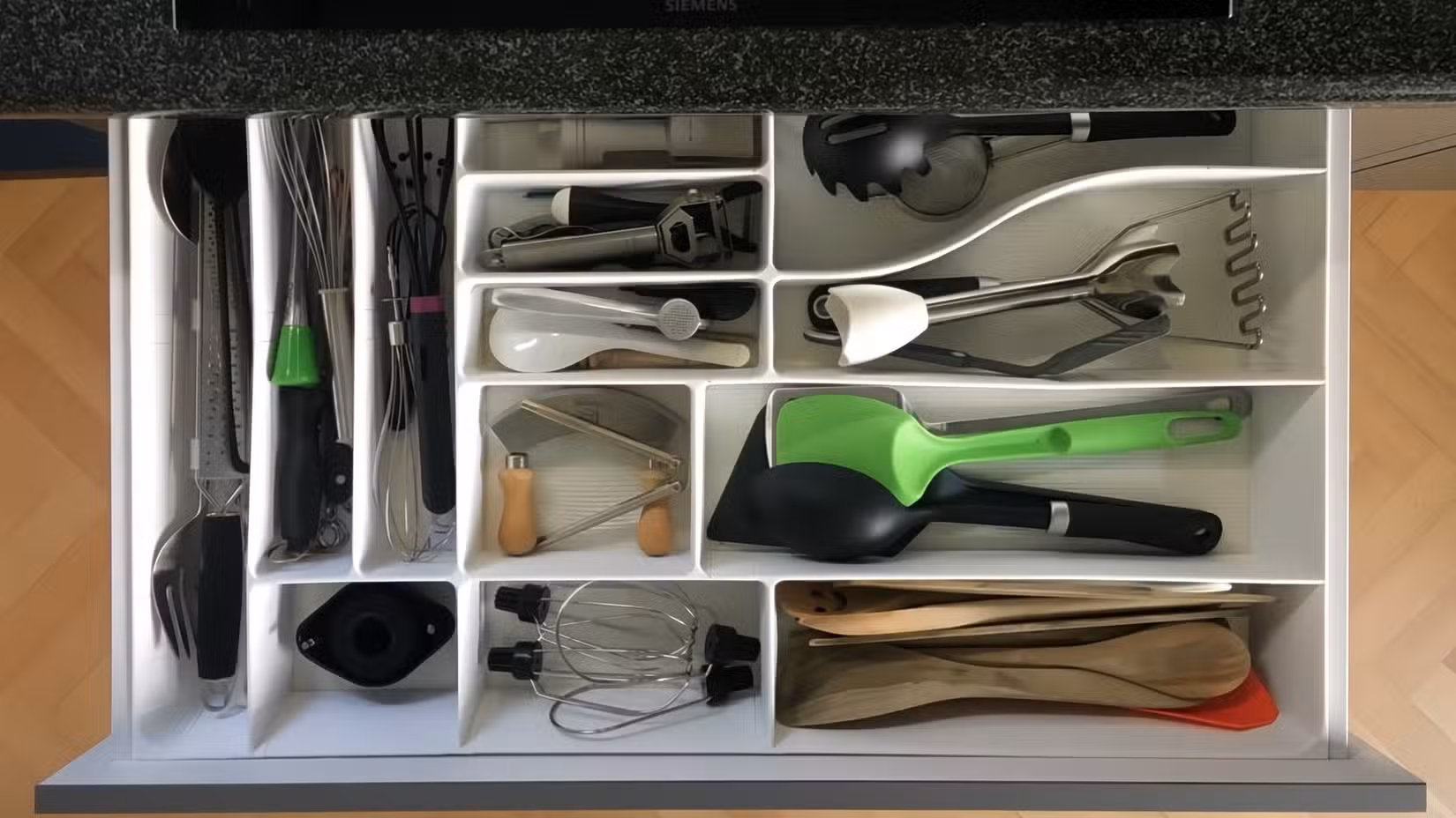 A drawer with dividers in it