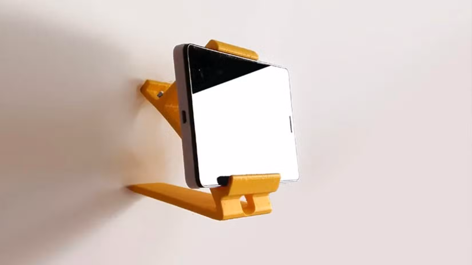 A wall stand for a phone