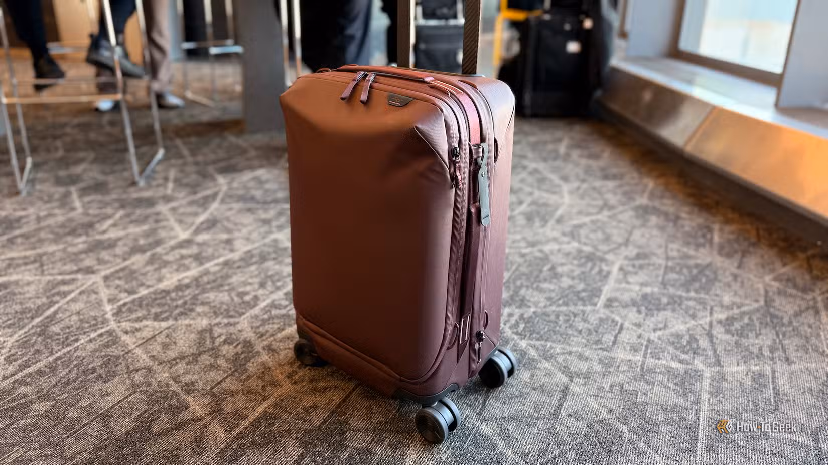 Peak Design Roller suitcase at an airport.