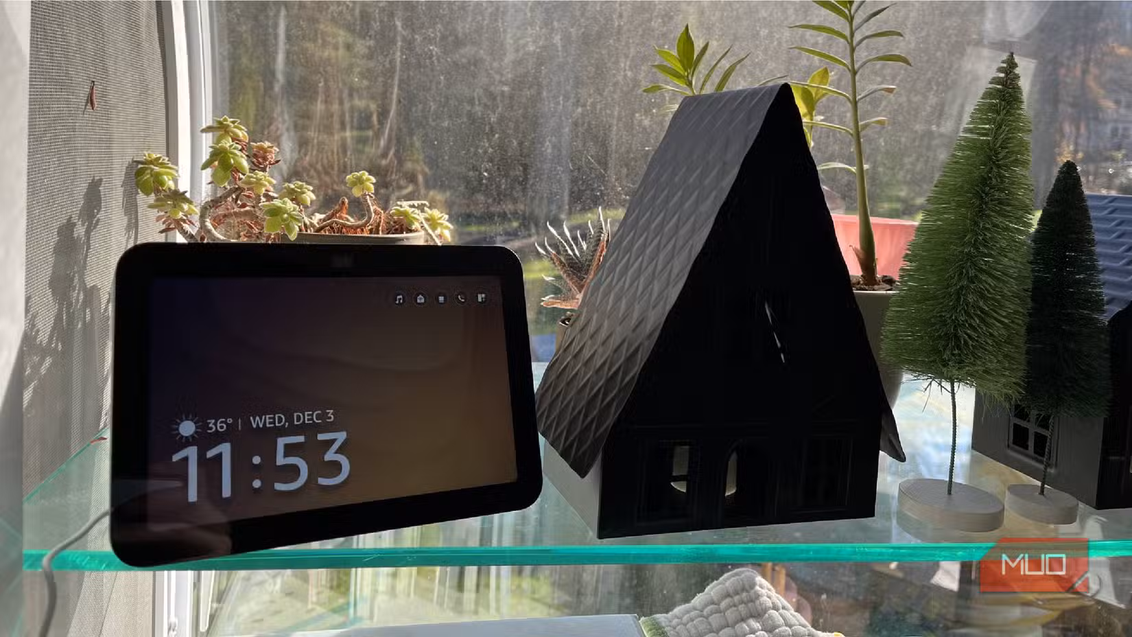 An Amazon Echo Show 8 next to some decorations