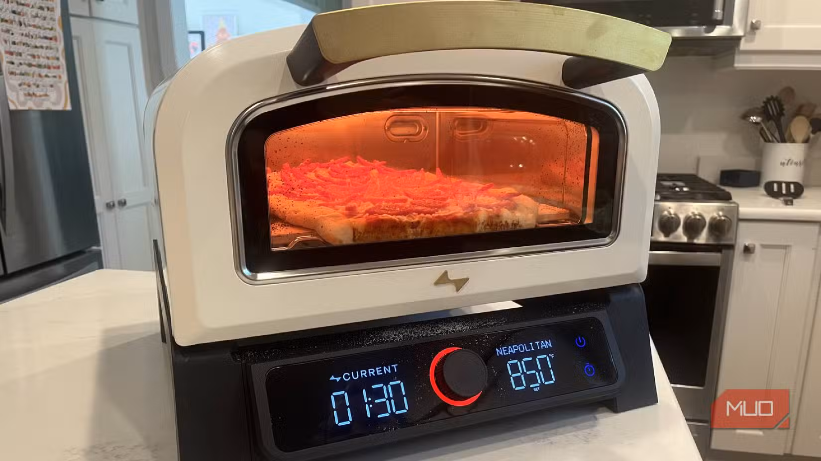 The Current Model P Smart Pizza Oven with a pizza in it
