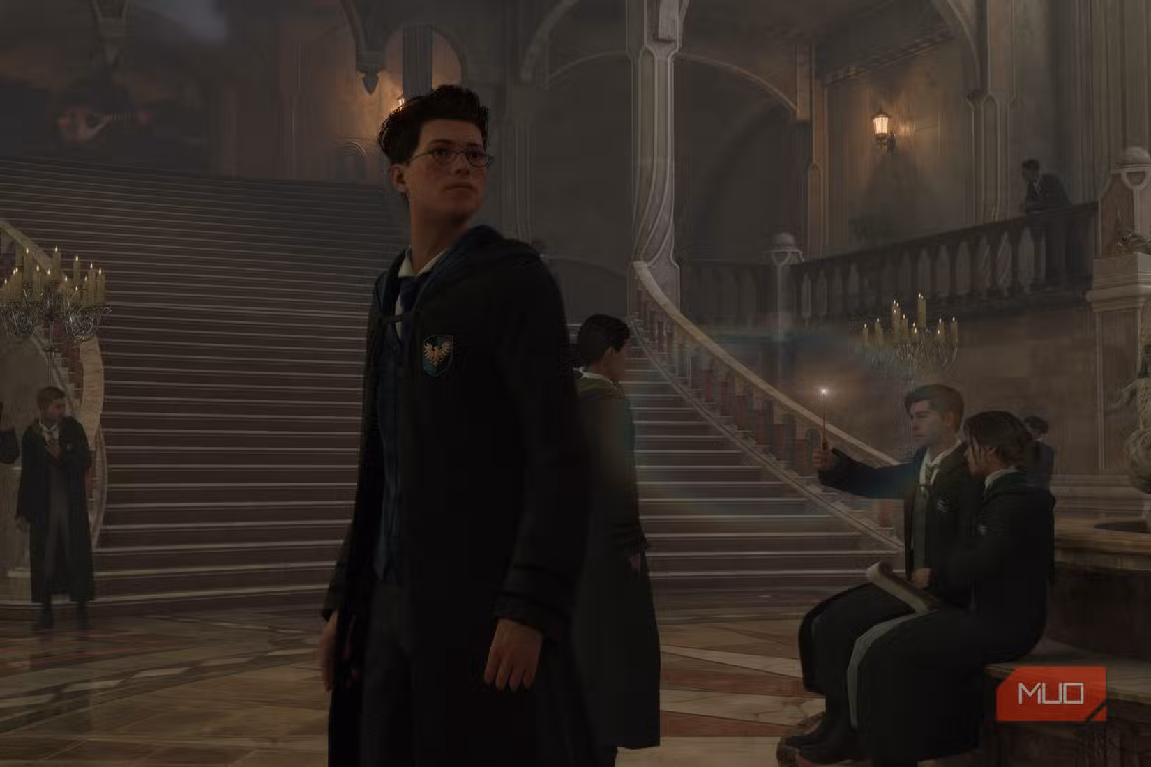 A wizarding pupil standing in a hall in Hogwarts Legacy