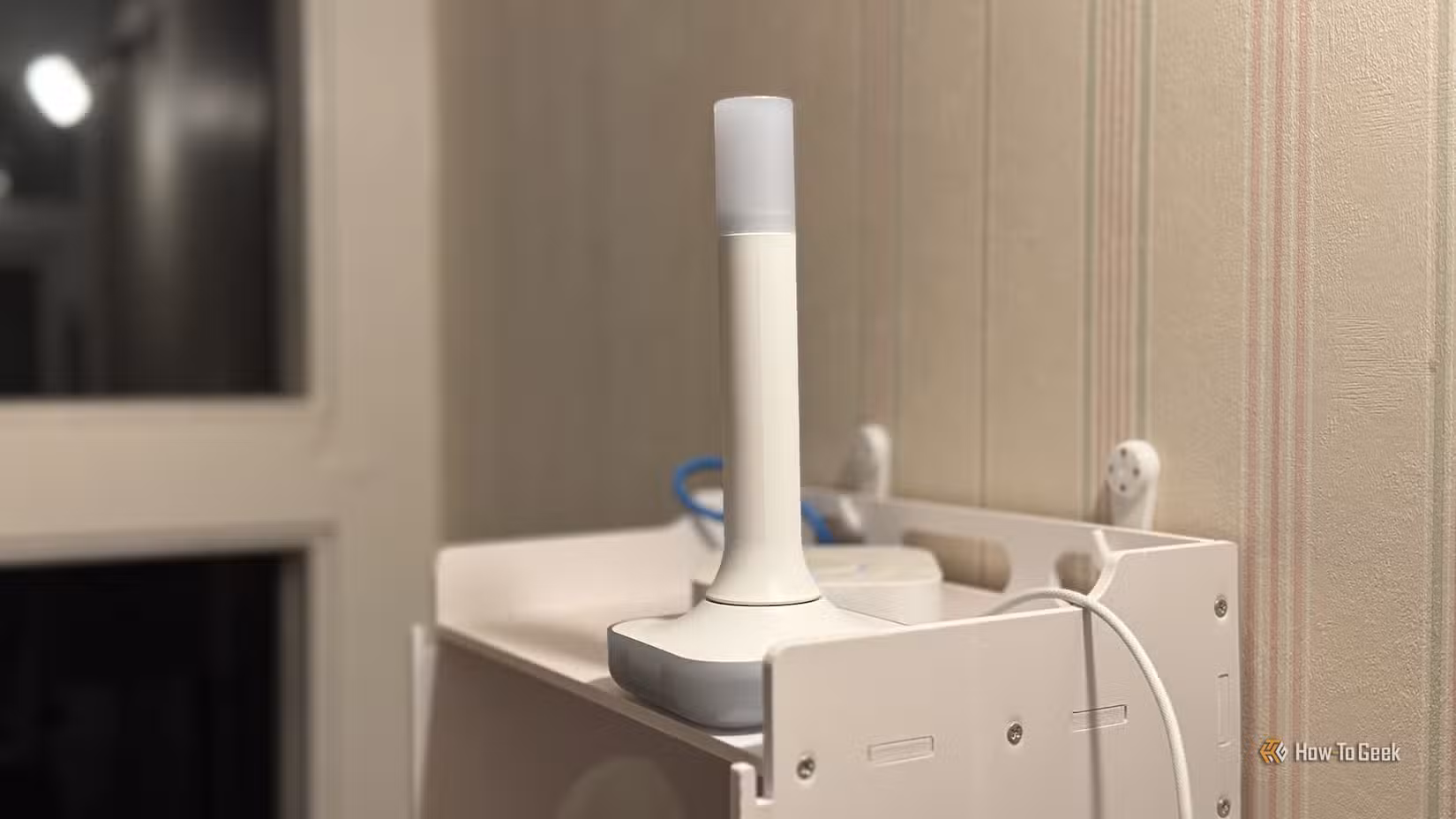 A Home Assistant Connect ZBT-2 on a shelf.