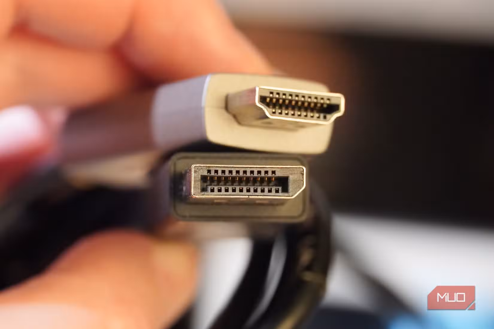 Comparing an HDMI cable to a DisplayPort cable.