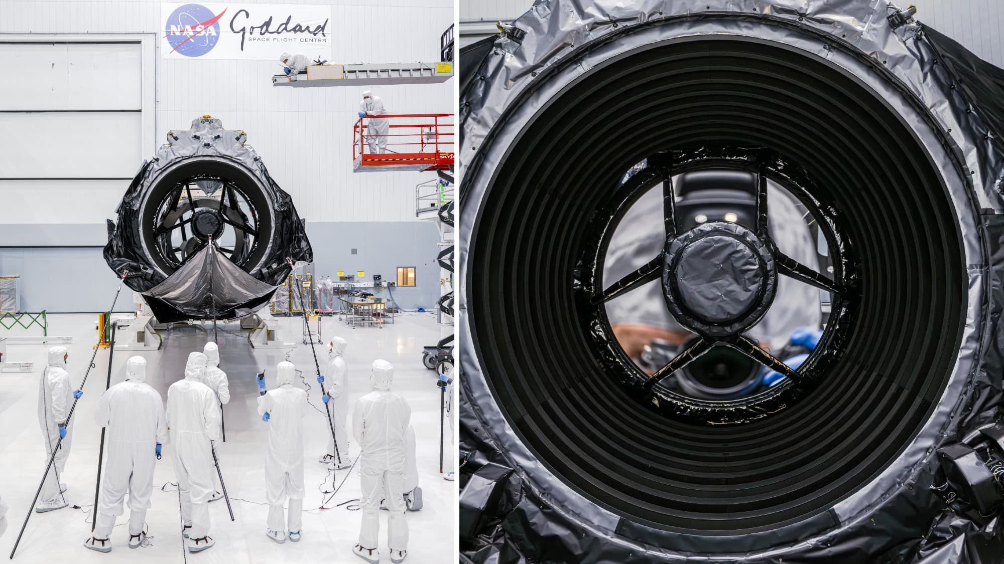 technicians in clean suits in a hangar next to a large rectangular spacecraft wrapped in metallic foil