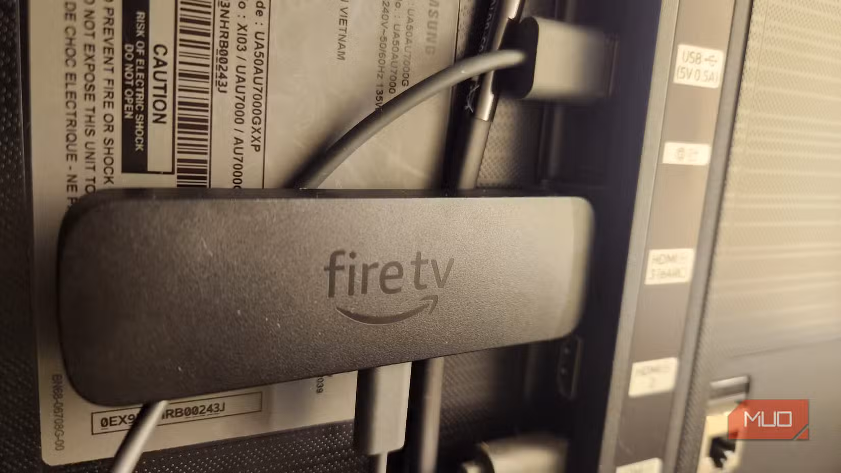 Fire TV Stick plugged into a TV.