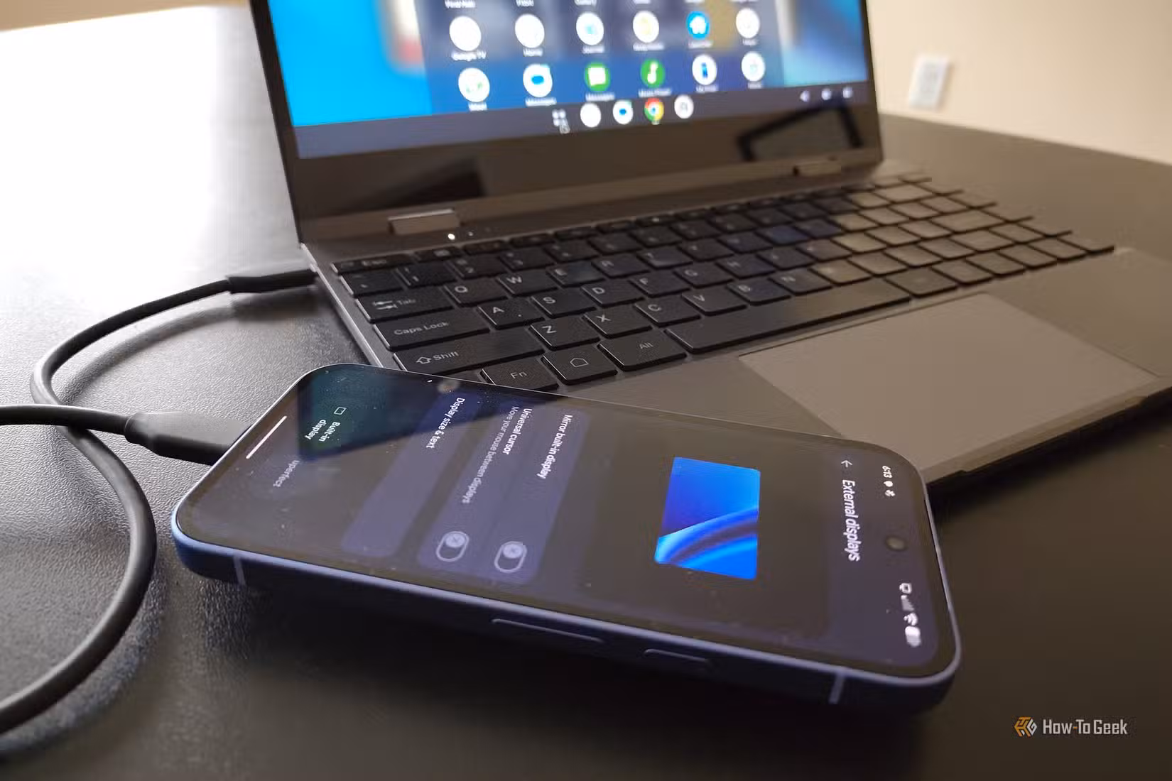 Google Pixel 10a plugged into a lapdock.