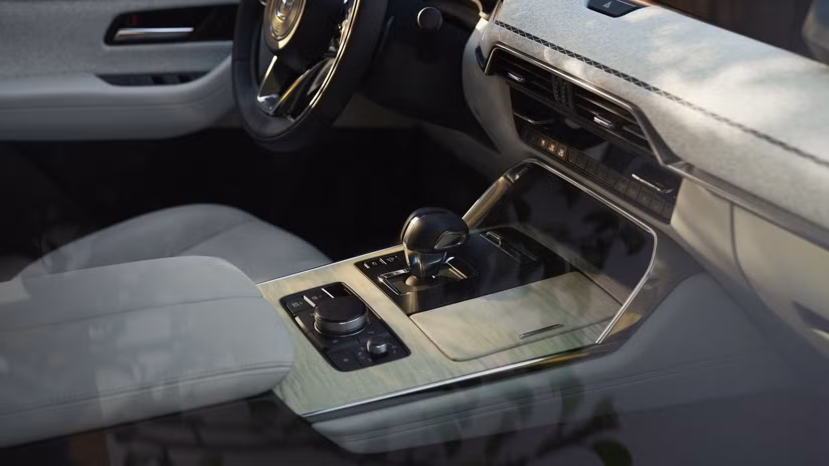 Close-up shot of the center console inside the cabin of a 2024 Mazda CX-90.