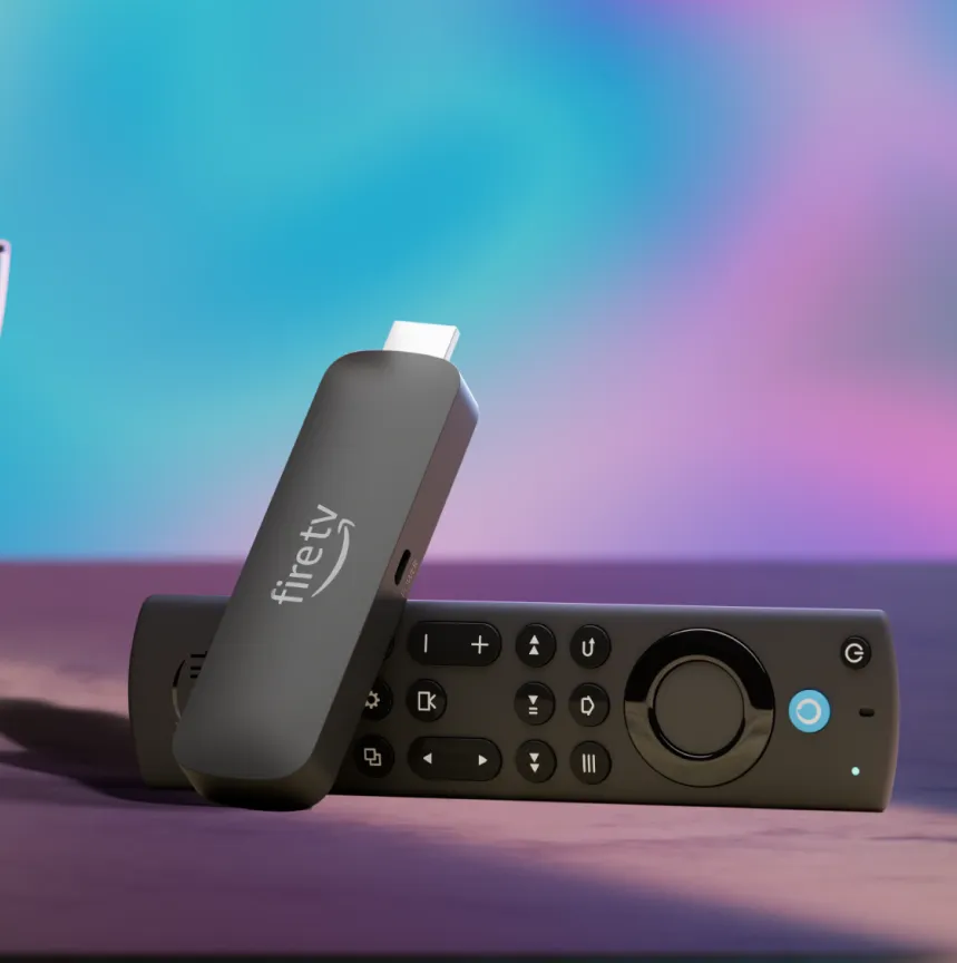 An Amazon Fire TV Stick 4K Max streaming stick with its remote sitting beside a bowl of popcorn in front of a TV.