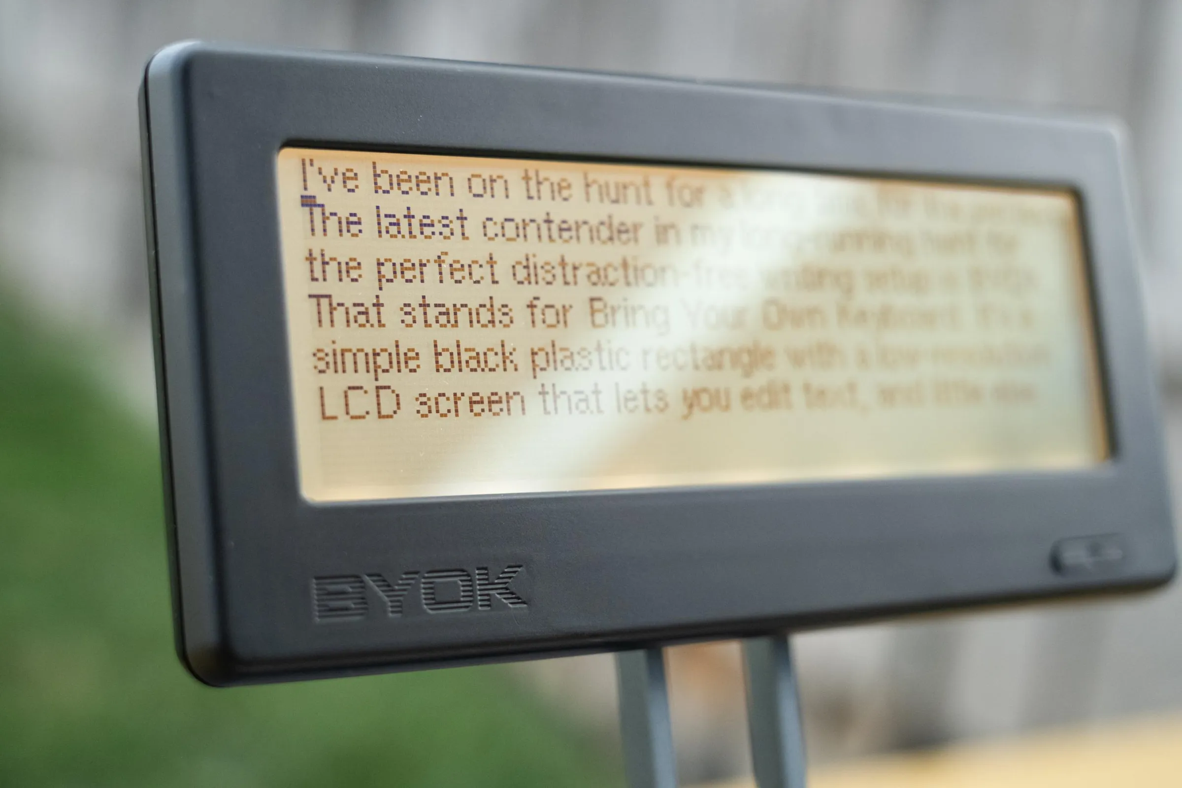 The BYOK at an angle under strong sunlight outdoors.