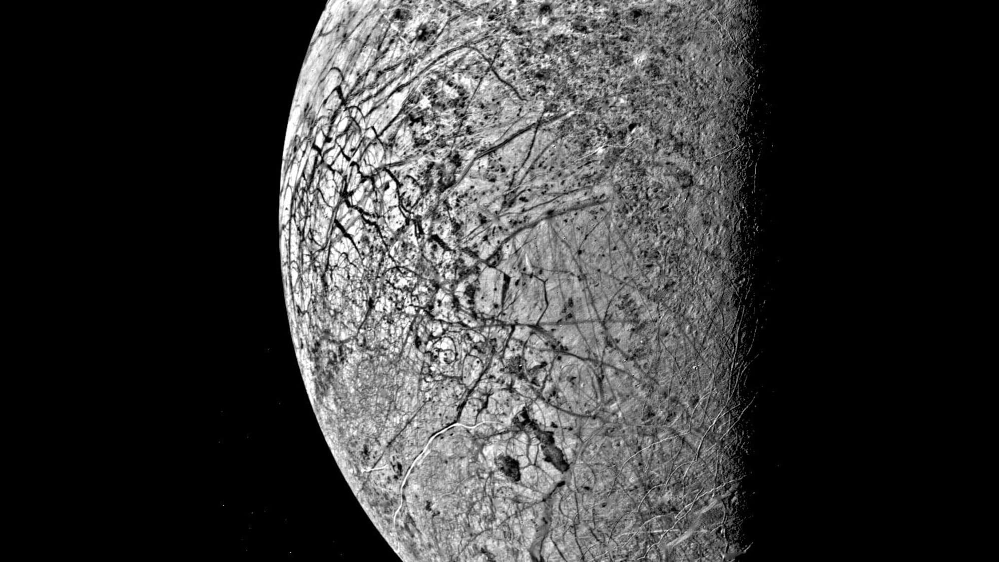 Europa moon of Jupiter photographed by Voyager 2 in 1979 showing cracked icy surface