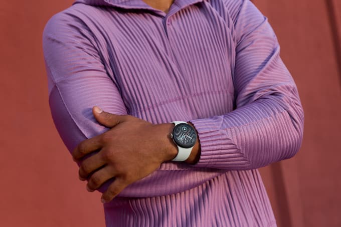 Pixel Watch 5 with Fog active band shown on wrist during outdoor activity